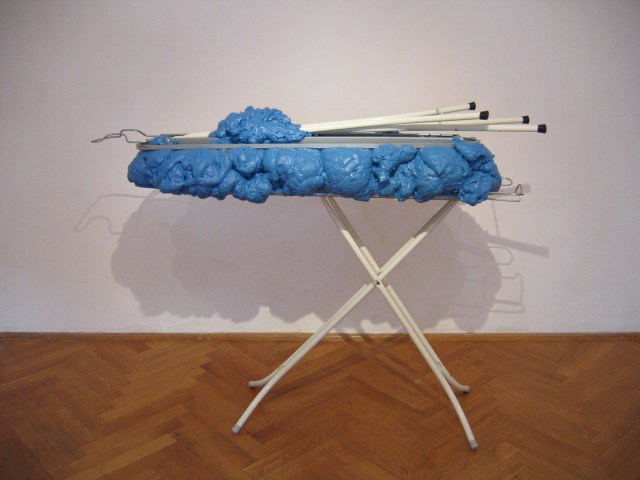 © Wilhelm Roseneder. Hellblaue Erweiterung/Light-blue expansion, 2006. Austrian Cultural Forum. Bratislava, Slovakia 2007. Polyurethan, Acryllack, Metall (Bügelbrett)/Polyurethane, acrylic varnish, metal (Ironing board), 1.10x1.50x60 cm
